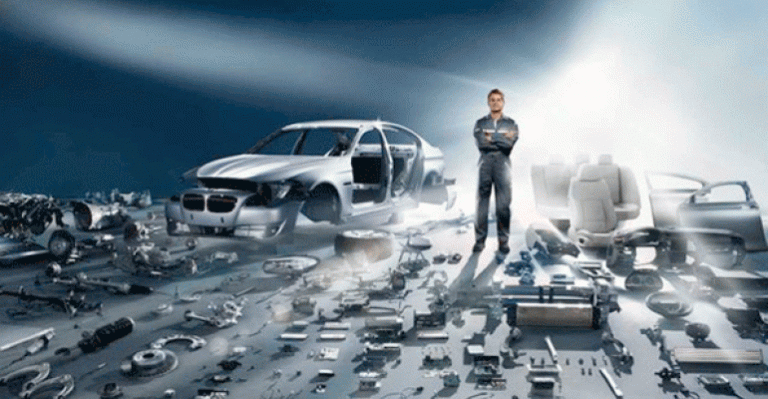 A veteran in a jumpsuit stands confidently beside an almost completely disassembled car, surrounded by various parts and components spread out on the ground, showcasing his skillful resettlement into civvy street.