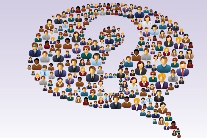 Illustration of a speech bubble formed by diverse illustrated people in various professional attire, centered on a question mark, symbolizing the resettlement journey from military roles to Civvy Street.