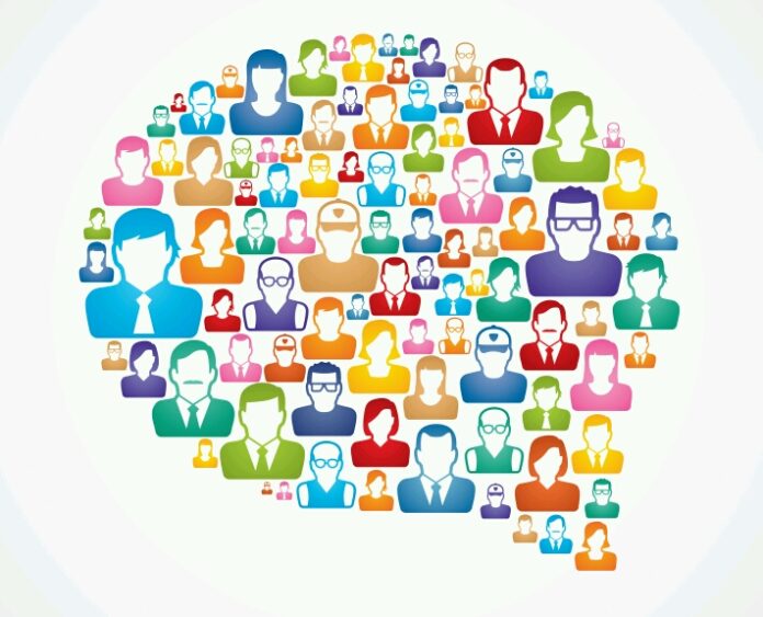 An illustration of various colorful avatars forming a speech bubble shape, featuring diverse representations of people from different professions and styles, including veterans resettling into civilian life.