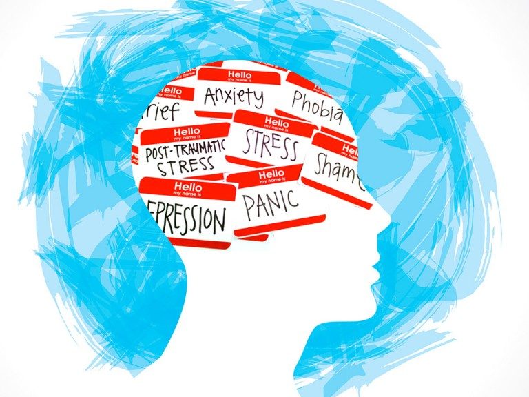 Silhouette of a head with "Hello" labels inside, displaying words like anxiety, stress, and depression against a blue brushstroke background. The display is part of the Military Mental Health Conference Programme just announced.