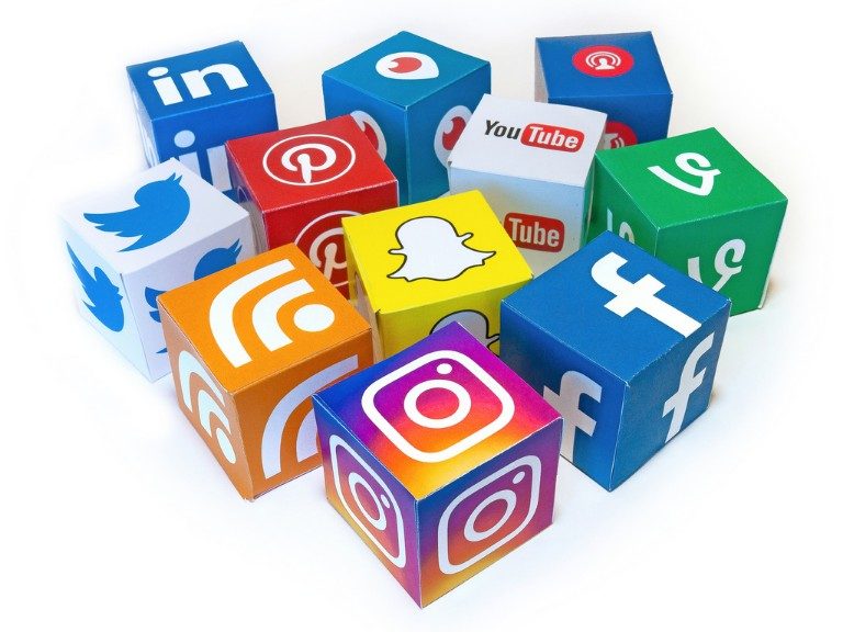 A vibrant collection of colorful cubes showcases the logos of prominent social media platforms like Facebook, Twitter, Instagram, and YouTube. This captivating arrangement reminds us of social media's takeover in everyday life, especially on significant occasions like World Mental Health Day.