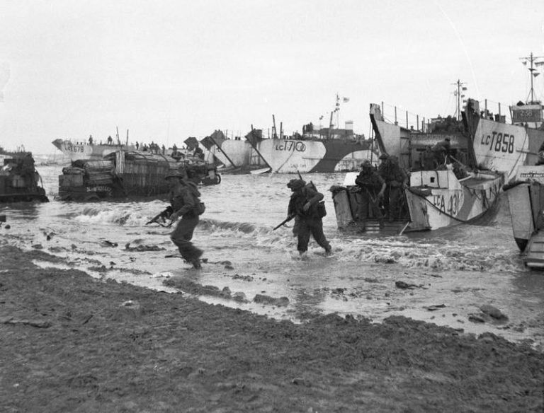 Marking the 75th Anniversary, soldiers disembark from landing crafts onto a beach, with military vehicles and ships in the background. Williamson invites D-Day Veterans to commemorate this historic event, honoring their bravery and sacrifice on the shores of history.