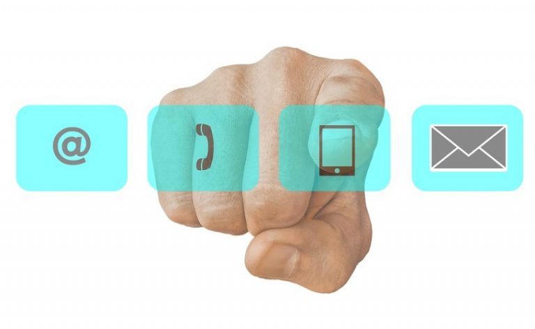 A hand pointing forward highlights the Veterans’ Gateway, with icons for email, phone, mobile, and mail neatly arranged in blue squares.