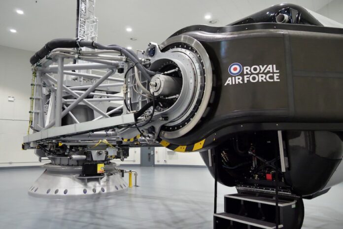 A black flight simulator labeled 