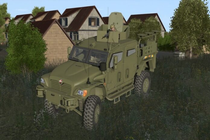 An innovative military vehicle is parked on the grass near houses, with a person visible in a turret on top. Trees and additional buildings form the backdrop, reflecting advanced army virtual reality training scenarios unfolding in this serene landscape.