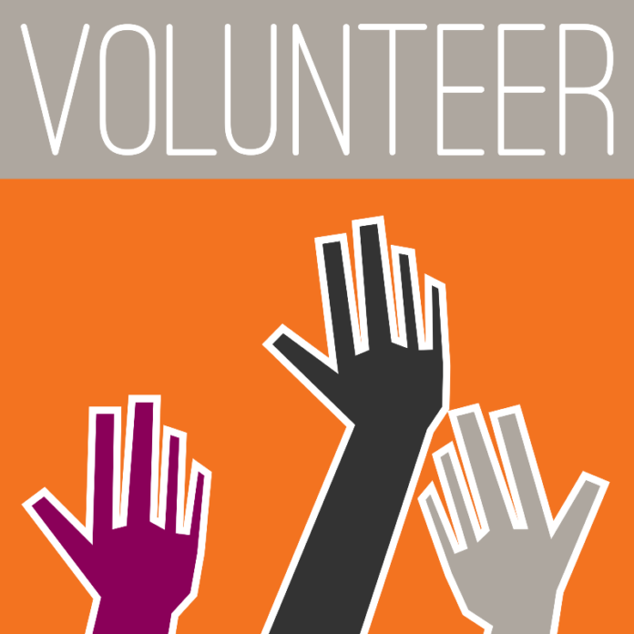 Three illustrated hands in purple, black, and white reach up against an orange background, symbolizing the spirit of 