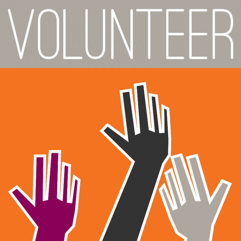 Three illustrated hands in purple, black, and white reach up against an orange background, symbolizing the spirit of "Volunteering For A Balanced Life." The word "VOLUNTEER" stands prominently at the top on a gray stripe, inspiring collective action and community support.
