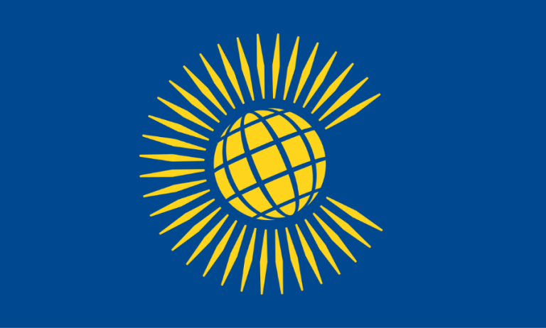 The flag of the Commonwealth showcases a yellow globe with radiating lines on a blue background, symbolizing unity amidst diversity. This emblem stands resilient despite discussions on unfair visa costs or legion calls for change within the organization.