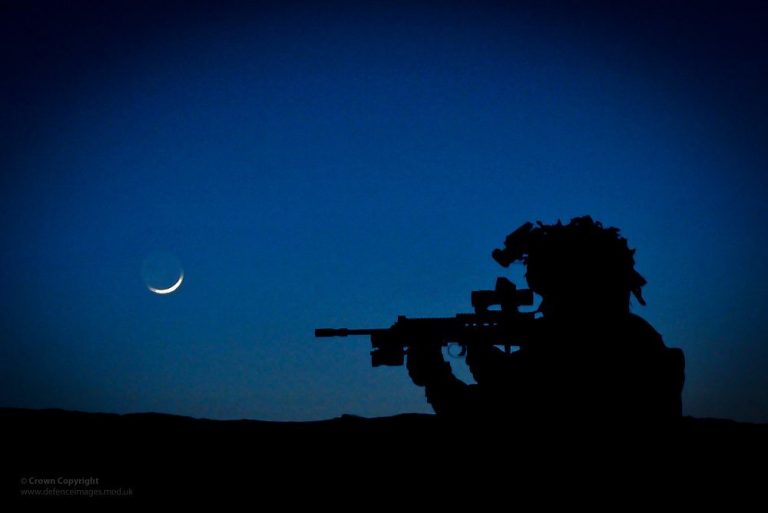 Silhouette of a soldier with a rifle against a twilight sky, investigating the serenity beneath a crescent moon, haunted by the shadows of PTSD.