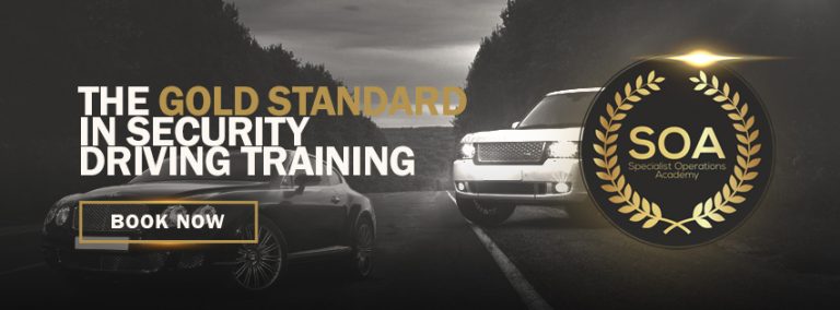 Two cars on a road with text: "The Gold Standard in Advanced Security Driving Course." A seal reads "SOA Specialist Operations Academy." A "Book Now" button is shown. Don't miss your chance to win a £1,300 prize at the Pathfinder Nottingham Expo.