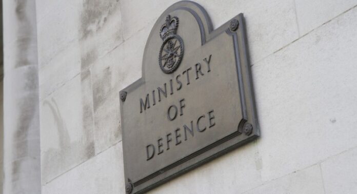 A plaque on a wall reads 