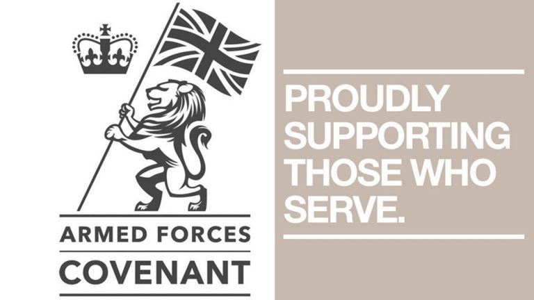 Logo of the Armed Forces Covenant with a lion holding a Union Jack. Text reads, "Proudly Supporting Those Who Serve." This emblem embodies the spirit of the Covenant's support programme, championing those who stand in service.