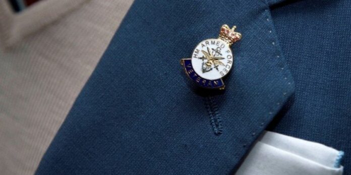 A lapel pin reading 