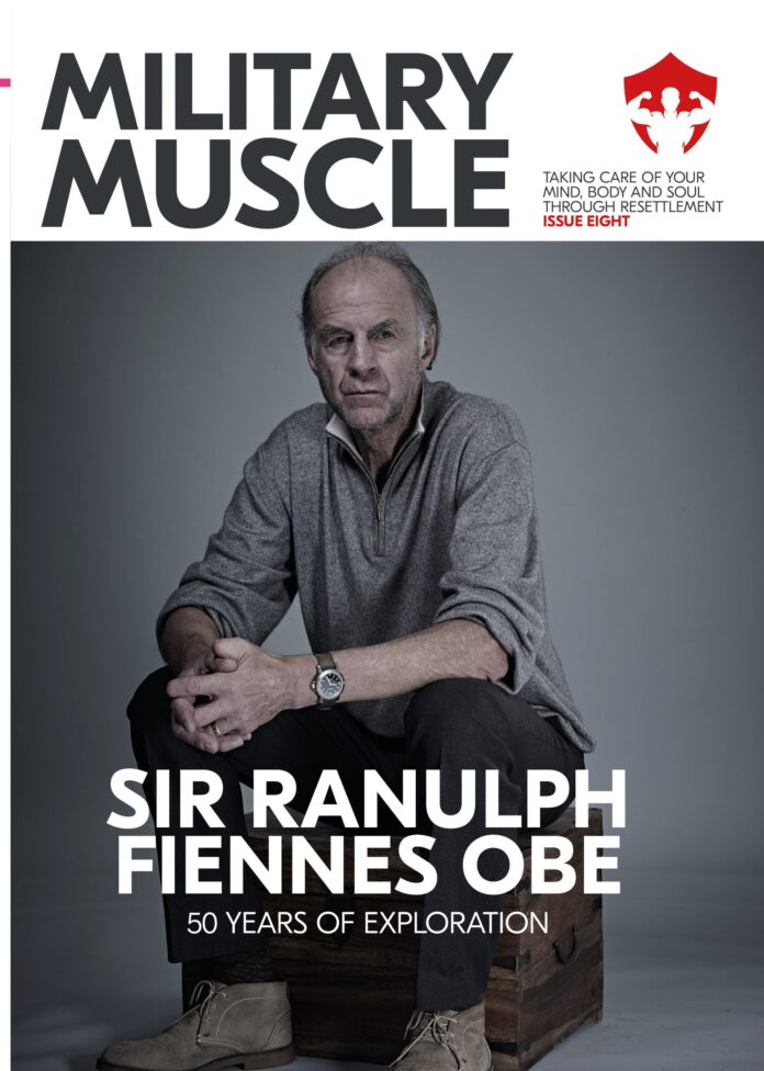 Sir Ranulph Fiennes, a renowned Military veteran, sits on a stool in a grey pullover on the cover of Military Muscle magazine issue eight, highlighting 50 years of exploration.