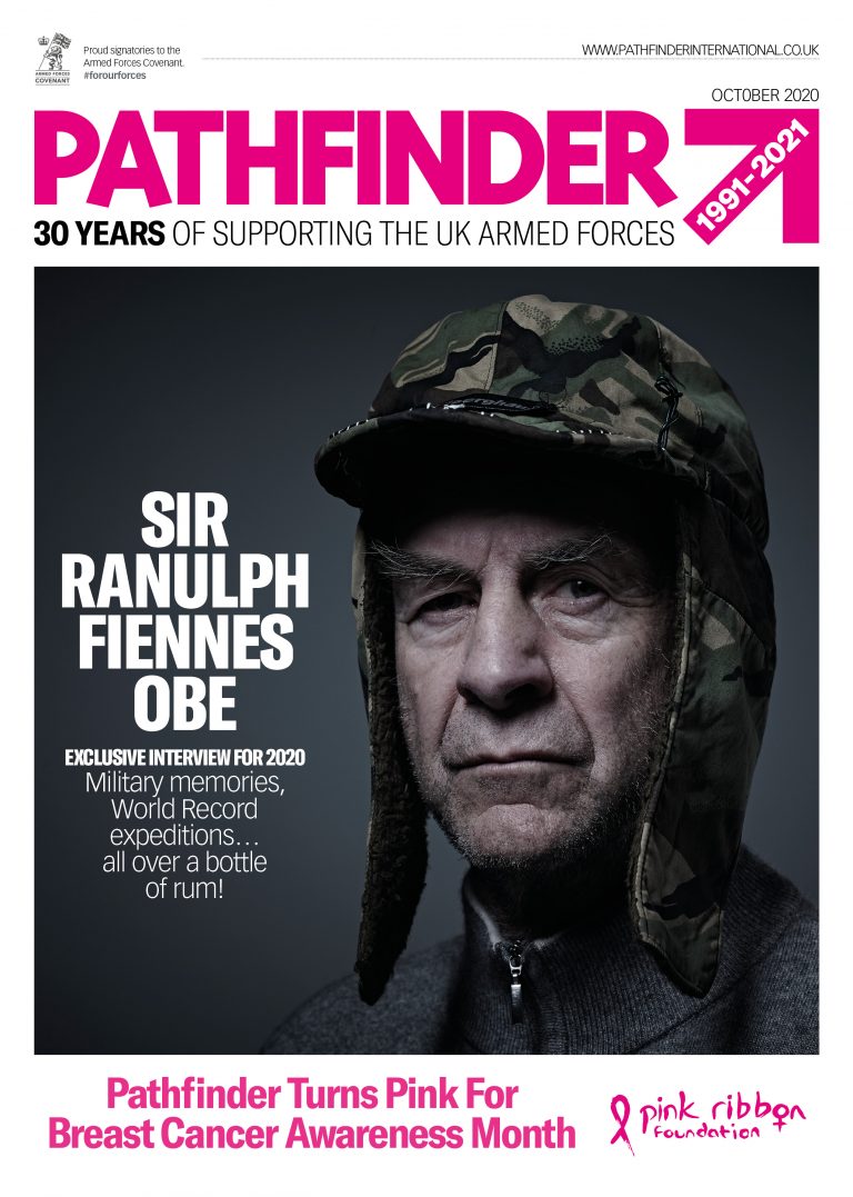 A serious-looking veteran in a camo trapper hat appears on the cover of Pathfinder magazine, announcing an interview with Sir Ranulph Fiennes and Breast Cancer Awareness Month.