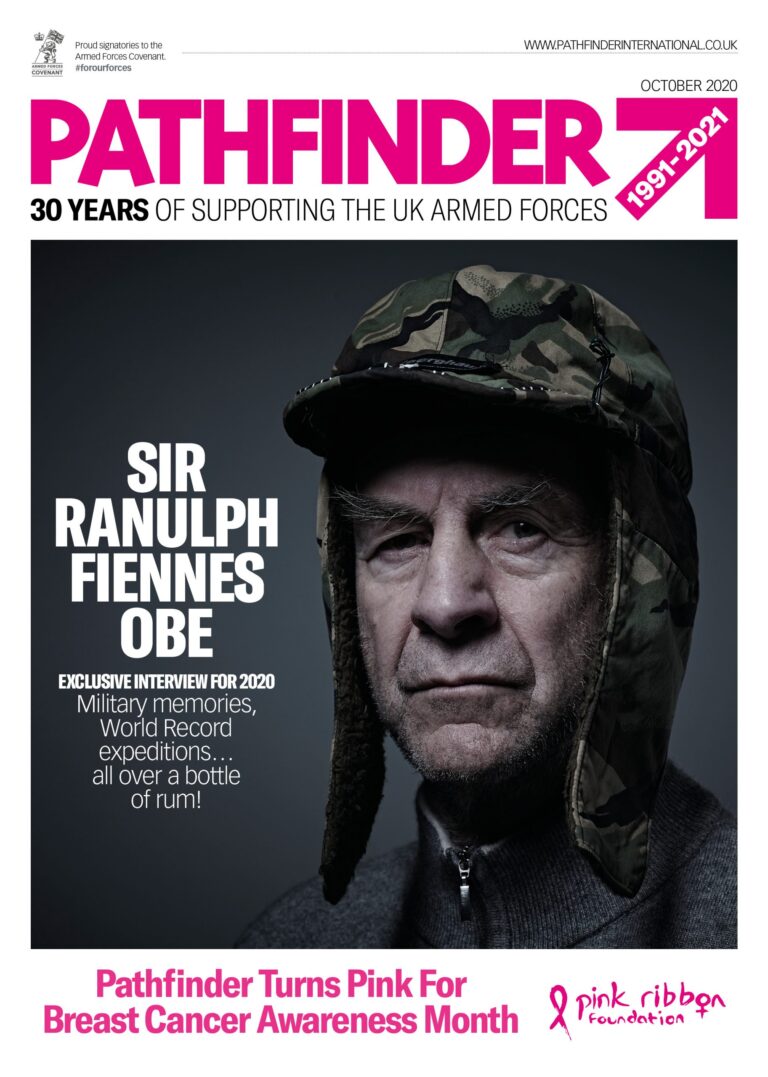 A serious-looking veteran in a camo trapper hat appears on the cover of Pathfinder magazine, announcing an interview with Sir Ranulph Fiennes and Breast Cancer Awareness Month.