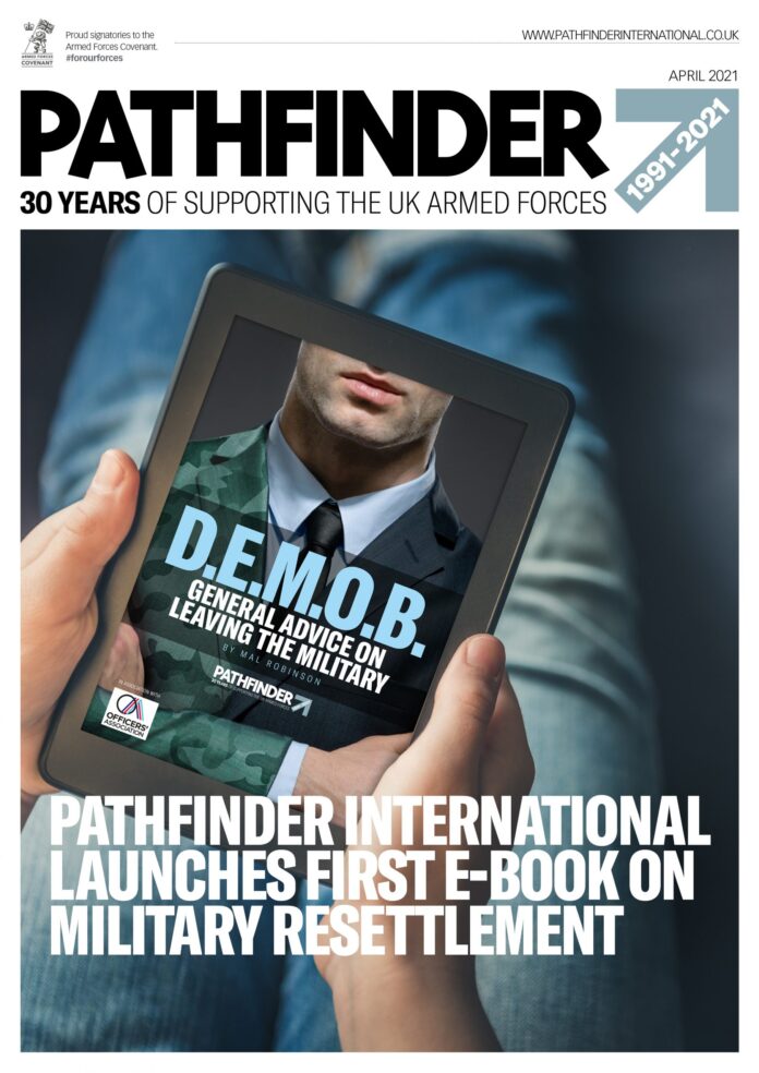 A veteran in military uniform holds a tablet displaying the cover of an e-book titled 