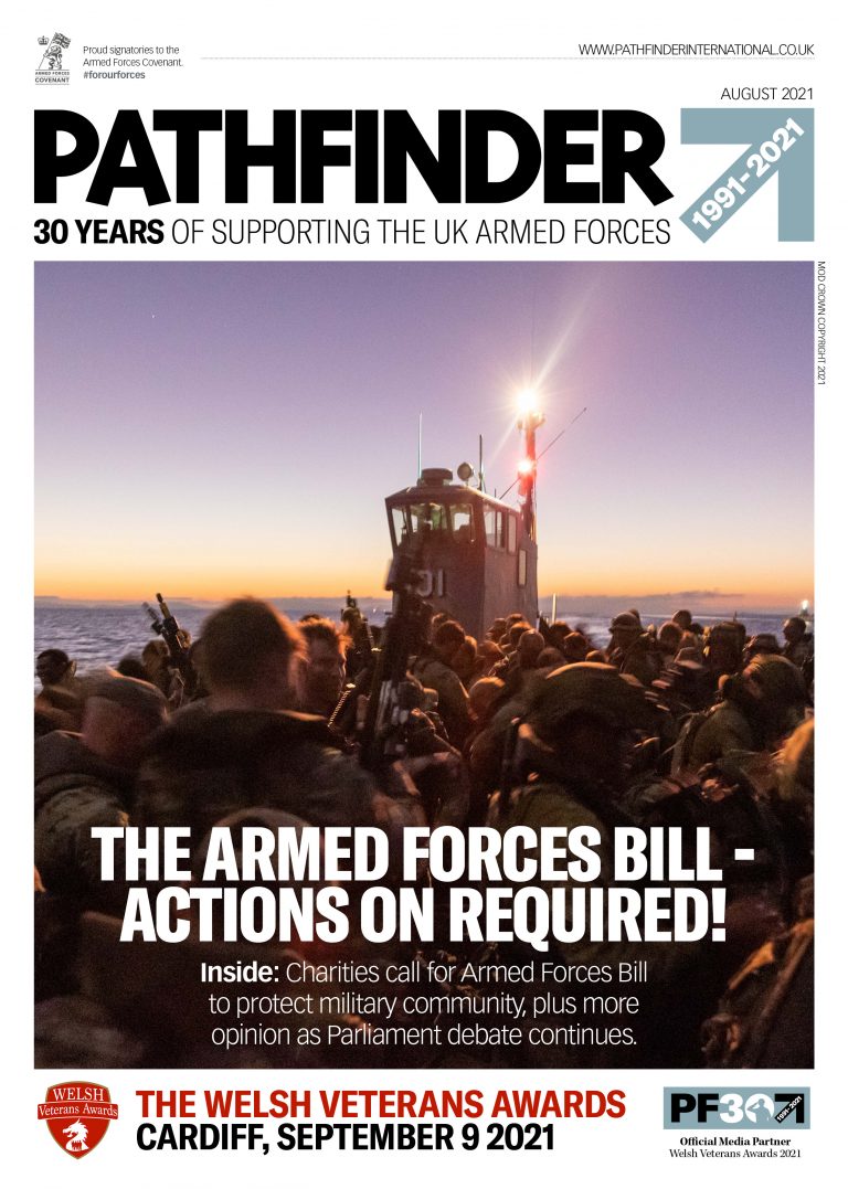 A group of armed soldiers, silhouetted at sunset, raise their hands on a boat; magazine cover highlights the UK Armed Forces Bill, Pathfinder Army Resettlement news, and Welsh Veterans Awards event details.