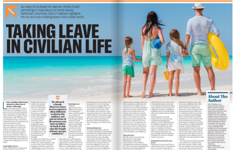 A family of four, seen from behind, walks toward the beach on a sunny day—a pathfinder moment as they head toward turquoise water and white sand in the background.