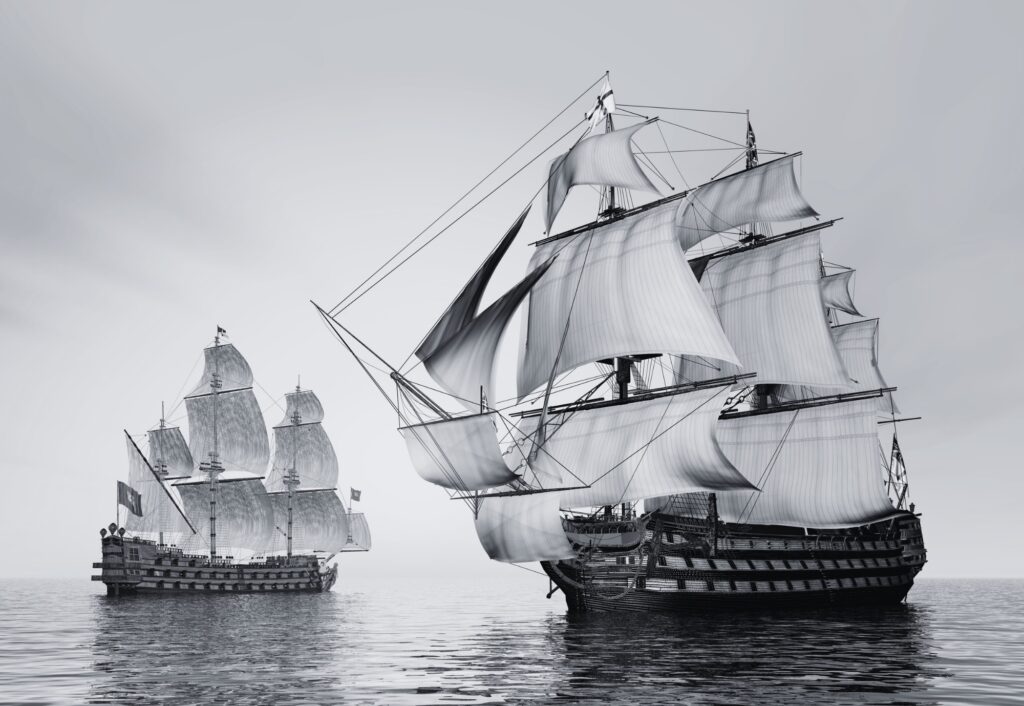 Two large sailing ships with multiple masts and sails navigate calm waters, reminiscent of a Trafalgar Night scene. The sky is overcast, adding to the immersive experience.