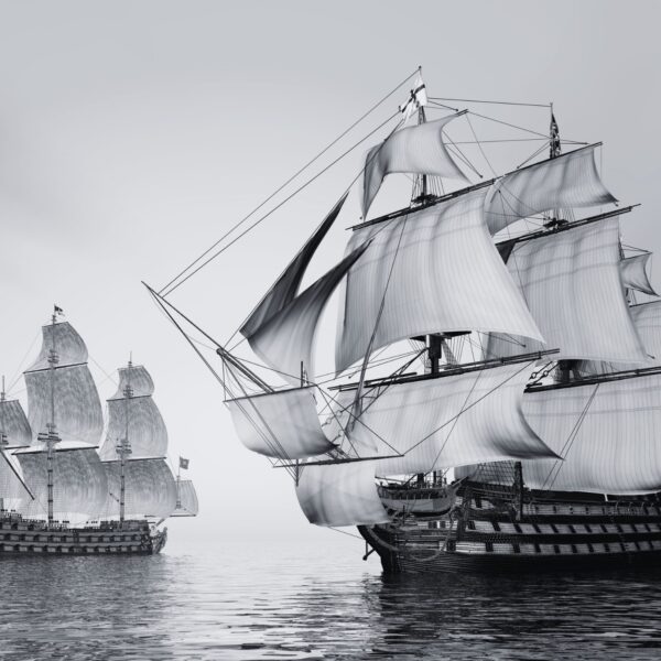 Two large sailing ships with multiple masts and sails navigate calm waters, reminiscent of a Trafalgar Night scene. The sky is overcast, adding to the immersive experience.