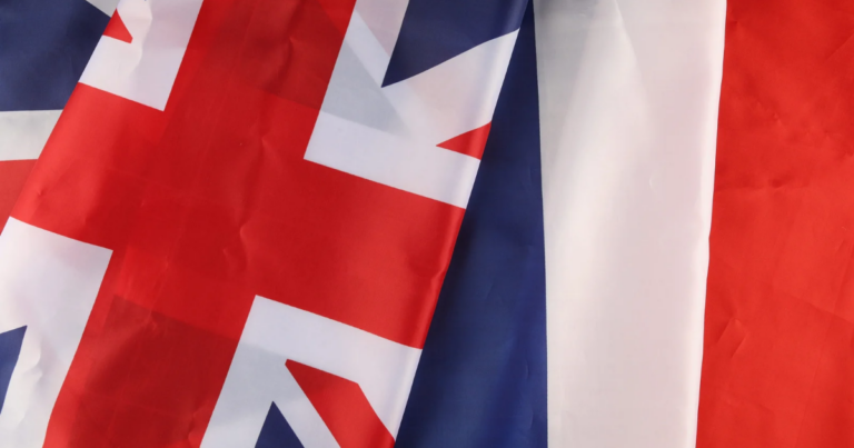 Close-up of overlapping British and French flags, symbolizing a strong UK-French Defence partnership and commitment to European security.