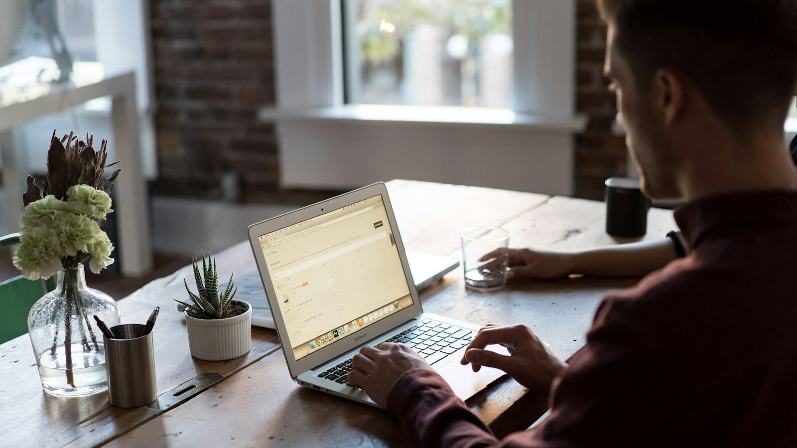 Photo by Bench Accounting man operating laptop on top of table