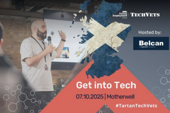 TechVets. A man speaks at a tech event in front of a screen showing the Scottish flag and event details for 