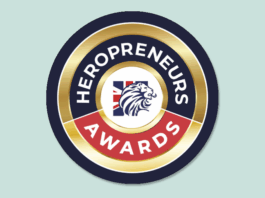 Heropreneurs Awards logo featuring a gold, black, red, and white circular badge with a lion head and Union Jack flag at the center—an emblem representing the 2025 finalists of the Heropreneurs Awards.